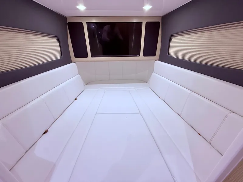 Slide: The Image of Luxurious interior cabin of 2024 Scout 400 LXF with white seating and modern design. - 49