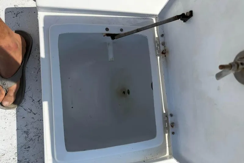 Slide: The Image of Open storage compartment on a 2008 Shallow Sport 18SS boat. - 13