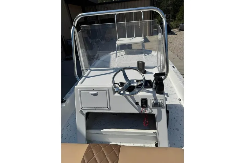 Slide: The Image of 2008 Shallow Sport 18SS boat console with steering wheel and controls. - 4