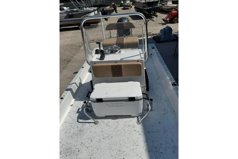 Slide: The Image of 2008 Shallow Sport 18SS boat with console and cooler on deck. - 6