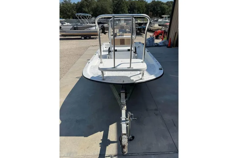 Slide: The Image of 2008 Shallow Sport 18SS boat on trailer, parked outdoors. - 8