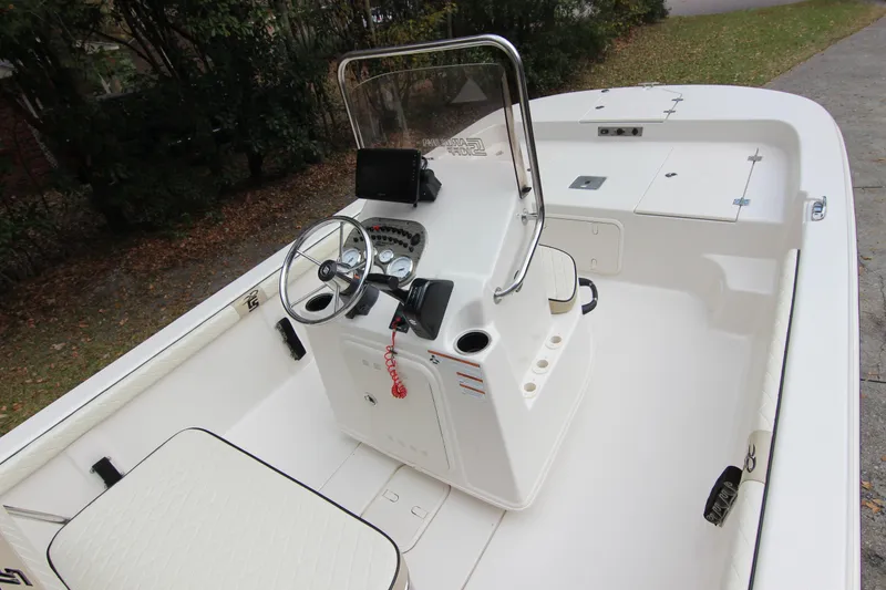 Slide: The Image of 2022 Carolina Skiff 19 LS boat interior with steering console and seating. - 10