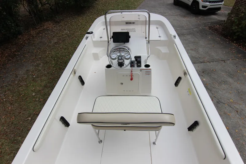 Slide: The Image of 2022 Carolina Skiff 19 LS boat interior with steering console and seating. - 11