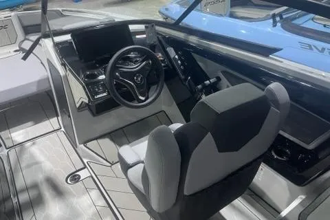Slide: The Image of 2025 Yamaha Boats 255XD cockpit with modern steering and dashboard design. - 5