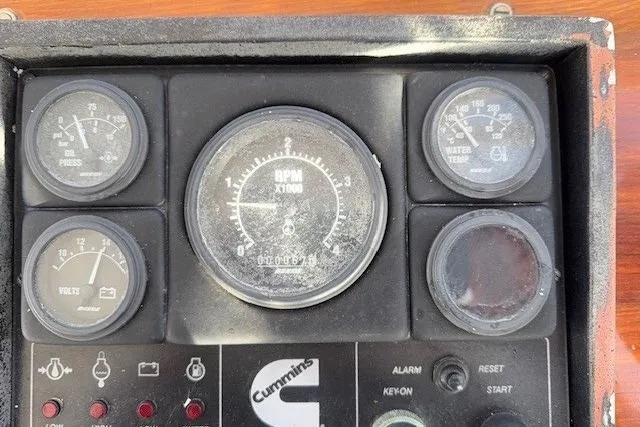Slide: The Image of Instrument panel of a 1975 Jarvis Newman 32 DEC boat with Cummins gauges. - 16