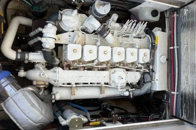 Slide: The Image of Engine compartment of a 1975 Jarvis Newman 32 DEC boat, showcasing detailed mechanical components. - 31