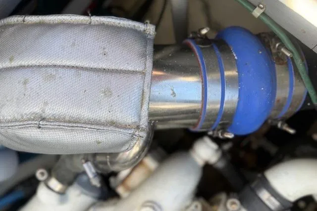 Slide: The Image of Engine component of a 1975 Jarvis Newman 32 DEC boat, featuring insulated piping. - 34