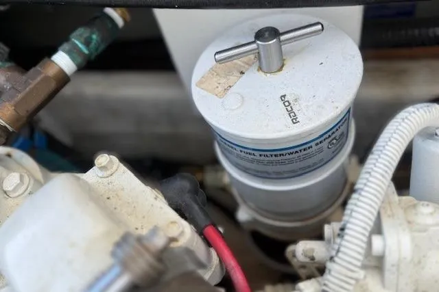 Slide: The Image of Fuel filter system in a 1975 Jarvis Newman 32 DEC boat engine compartment. - 35