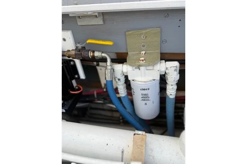 Slide: The Image of Engine compartment of a 1975 Jarvis Newman 32 DEC with fuel filter and hoses. - 36