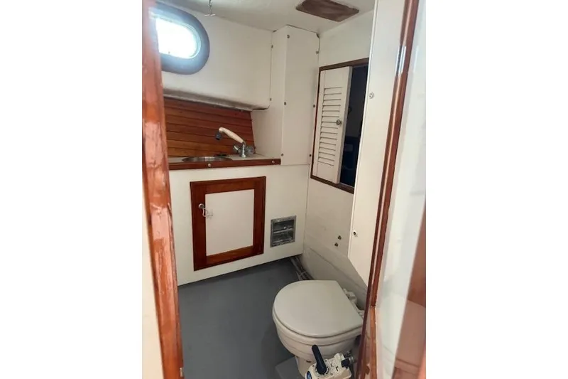Slide: The Image of 1975 Jarvis Newman 32 DEC boat interior bathroom with sink and toilet. - 43
