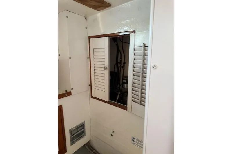 Slide: The Image of Interior view of a 1975 Jarvis Newman 32 DEC boat with wooden accents. - 44