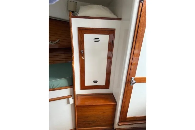 Slide: The Image of 1975 Jarvis Newman 32 DEC cabin interior with wooden storage and bunk. - 47