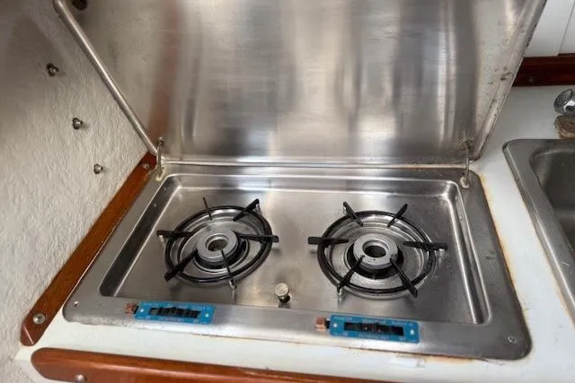 Slide: The Image of Stainless steel two-burner stove on a 1975 Jarvis Newman 32 DEC boat. - 53