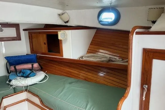 Slide: The Image of Interior of a 1975 Jarvis Newman 32 DEC boat with wooden accents and storage. - 60