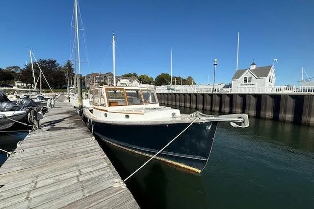 Slide: The Image of 1975 Jarvis Newman 32 DEC boat docked at a marina under clear blue skies. - 9
