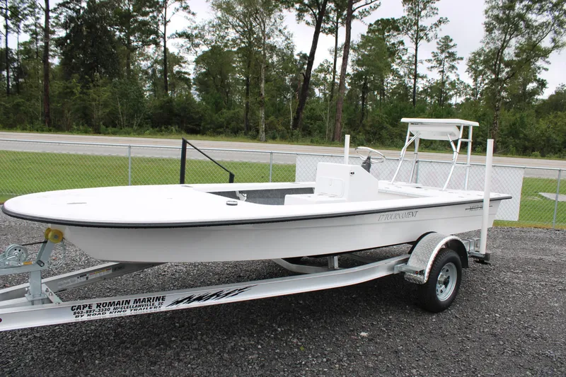 Slide: The Image of 2026 Mitzi Skiffs 17 Tournament boat on trailer, parked outdoors. - 4