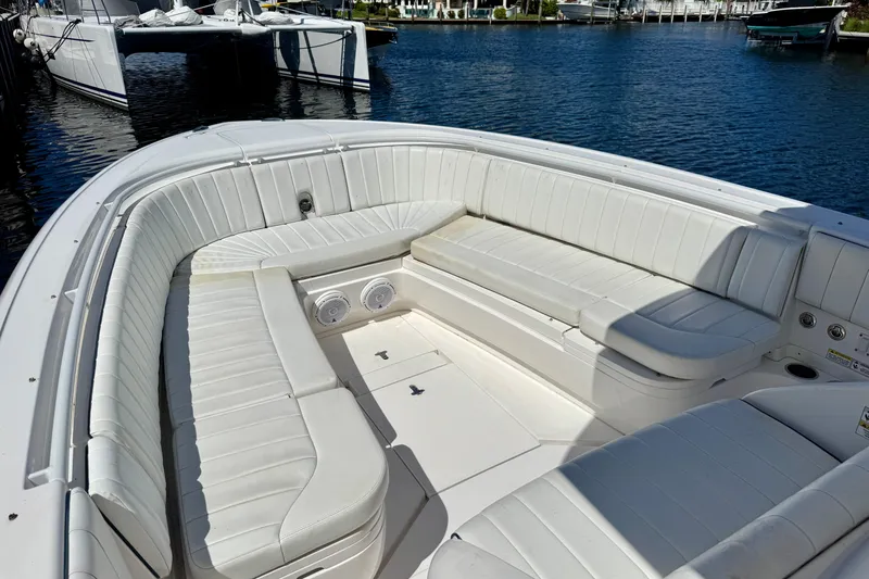 Slide: The Image of 2014 Intrepid 327 Center Console boat with spacious white seating area. - 11