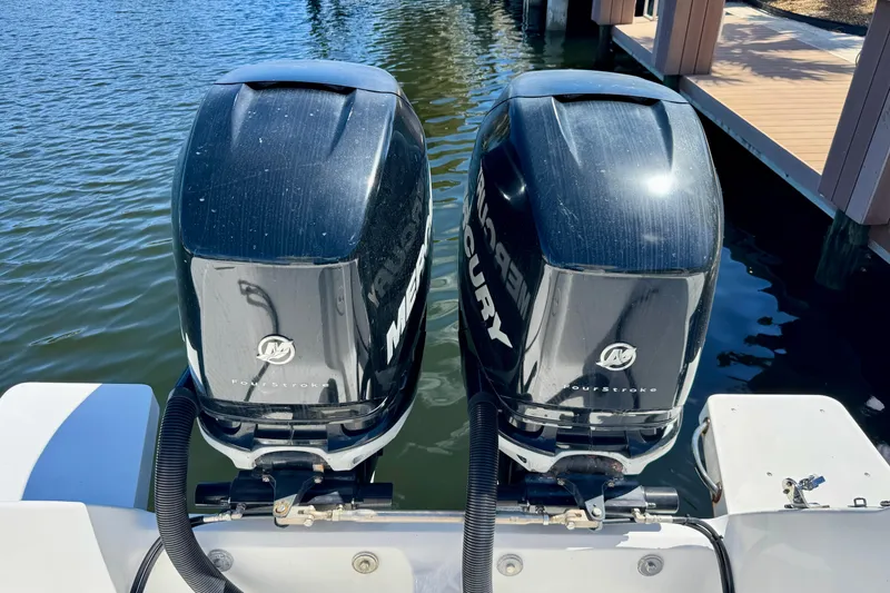 Slide: The Image of Twin Mercury outboard engines on a 2014 Intrepid 327 Center Console boat. - 20