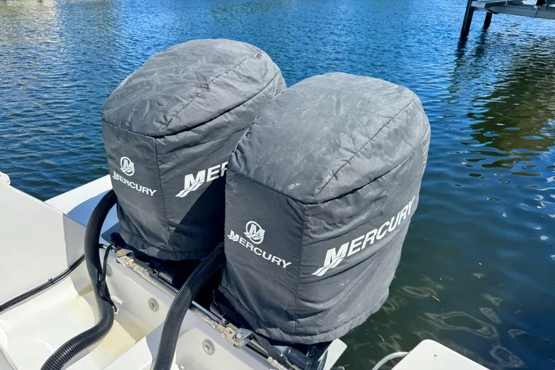Slide: The Image of Twin Mercury outboard engines on a 2014 Intrepid 327 Center Console boat. - 21