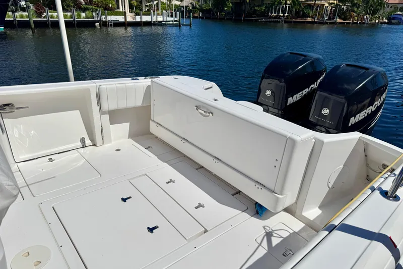 Slide: The Image of 2014 Intrepid 327 Center Console boat with dual Mercury engines on a sunny day. - 9