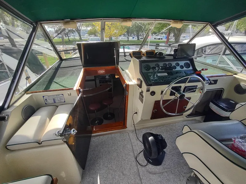 Slide: The Image of 1987 Chris-Craft 381 Catalina boat interior with helm, seating, and navigation equipment. - 14