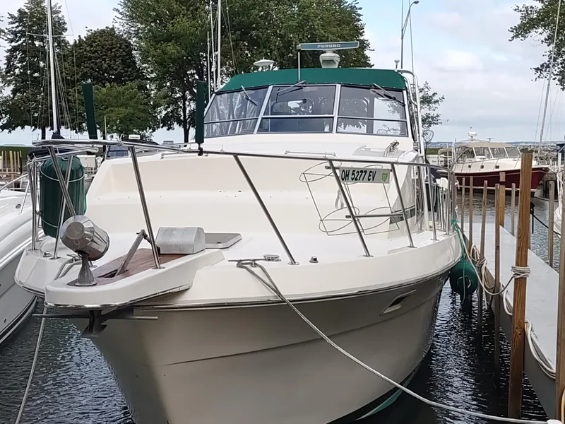 Slide: The Image of 1987 Chris-Craft 381 Catalina docked, featuring sleek design and spacious deck. - 2