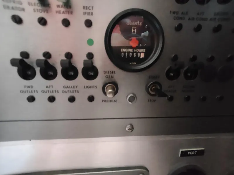 Slide: The Image of Control panel of 1987 Chris-Craft 381 Catalina with engine hour meter and switches. - 24