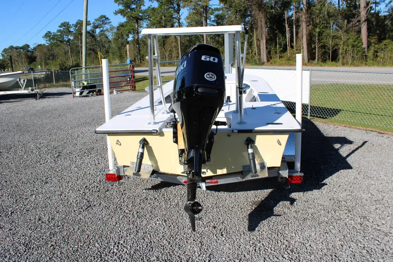 Slide: The Image of 2026 Mitzi Skiffs 17 Tournament boat with outboard motor on trailer. - 17
