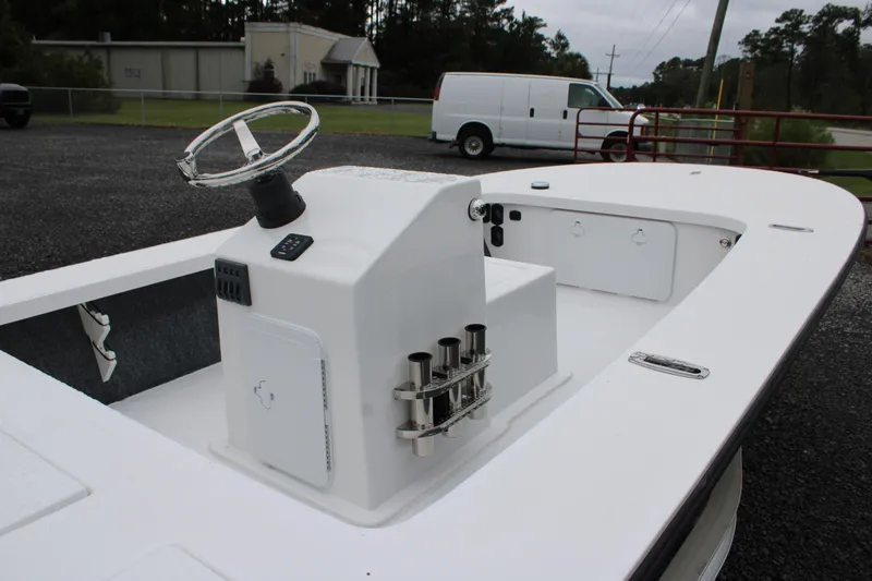 Slide: The Image of 2026 Mitzi Skiffs 17 Tournament boat with T-top, parked on gravel near a fence. - 5