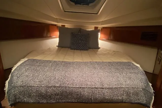 Slide: The Image of Luxurious cabin interior of 2008 Sea Ray 400 Sundancer yacht with cozy bedding. - 10