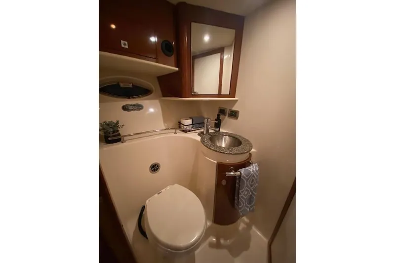Slide: The Image of 2008 Sea Ray 400 Sundancer bathroom with sink, mirror, and toilet. - 11