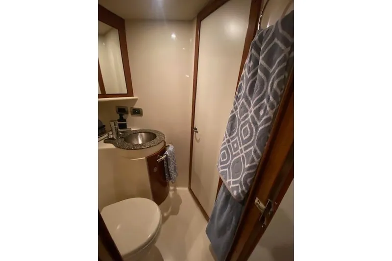 Slide: The Image of Bathroom interior of 2008 Sea Ray 400 Sundancer yacht with sink and towel. - 12
