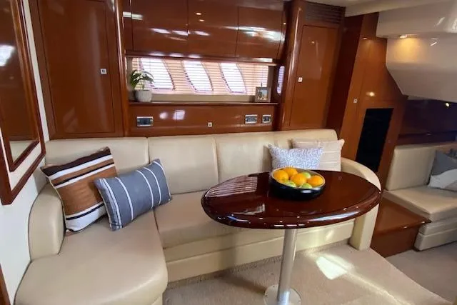 Slide: The Image of Luxurious interior of 2008 Sea Ray 400 Sundancer yacht with elegant seating and table. - 17