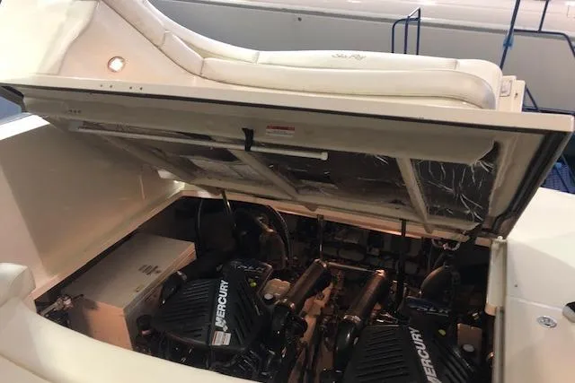 Slide: The Image of 2008 Sea Ray 400 Sundancer engine compartment with Mercury engines visible. - 22