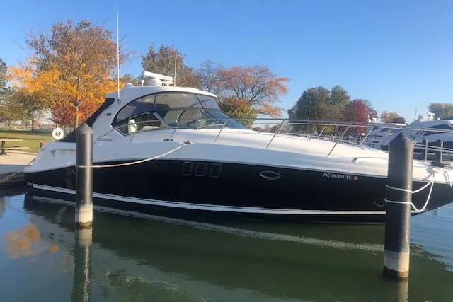 Slide: The Image of 2008 Sea Ray 400 Sundancer yacht docked in a serene marina setting. - 28