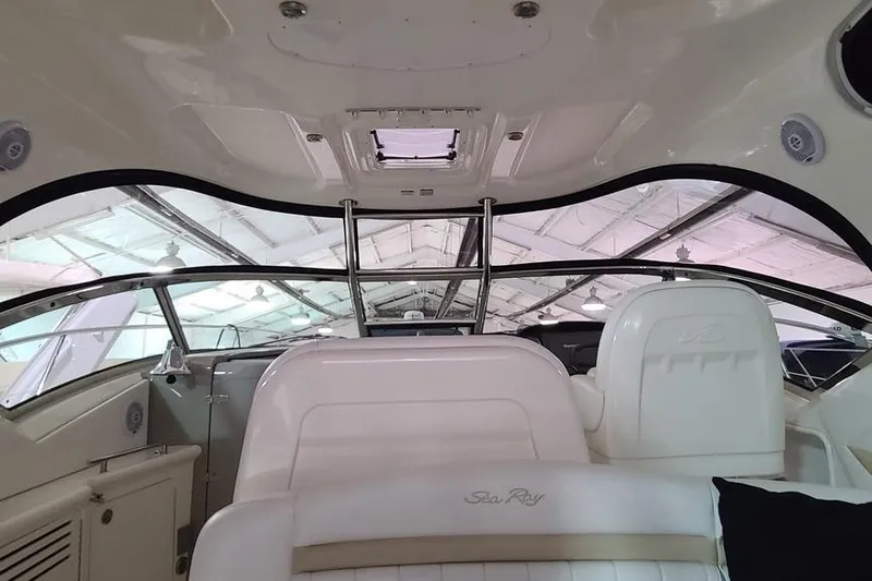 Slide: The Image of Interior view of 2008 Sea Ray 400 Sundancer yacht, showcasing helm and seating area. - 5