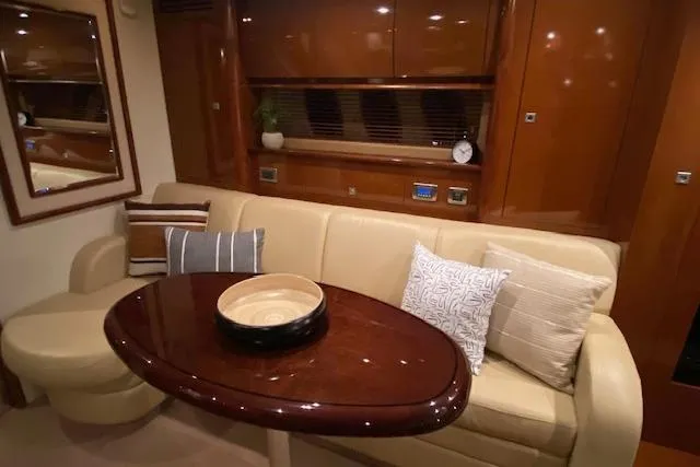 Slide: The Image of Luxurious interior of 2008 Sea Ray 400 Sundancer yacht with elegant seating and table. - 8