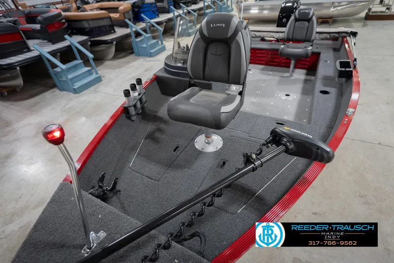 Slide: The Image of 2023 Lund 1650 Angler SS fishing boat interior with seating and trolling motor. - 12