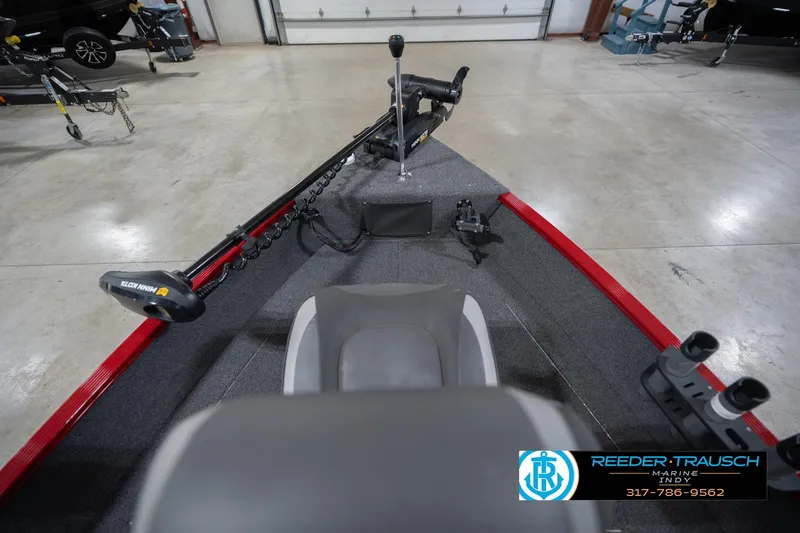 Slide: The Image of 2023 Lund 1650 Angler SS boat interior with Minn Kota trolling motor in showroom. - 18