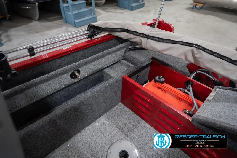 Slide: The Image of 2023 Lund 1650 Angler SS boat interior with storage compartments and equipment. - 23