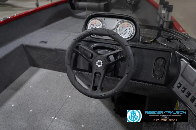 Slide: The Image of 2023 Lund 1650 Angler SS boat dashboard with steering wheel and gauges. - 28