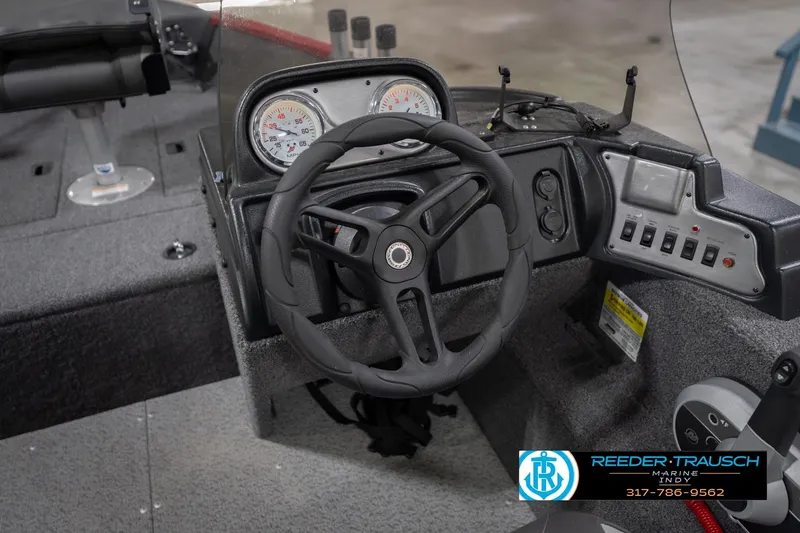 Slide: The Image of 2023 Lund 1650 Angler SS boat dashboard with steering wheel and control panel. - 29