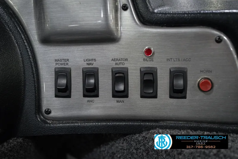 Slide: The Image of Control panel of 2023 Lund 1650 Angler SS boat with switches and indicators. - 33