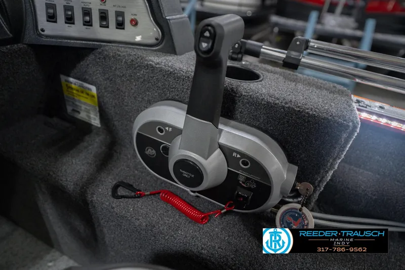 Slide: The Image of Control panel of 2023 Lund 1650 Angler SS boat with throttle and switches. - 34