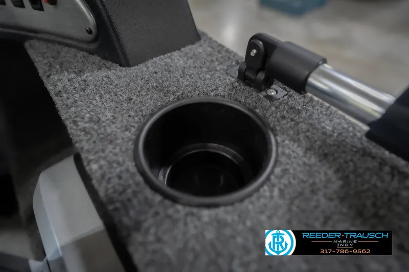 Slide: The Image of 2023 Lund 1650 Angler SS boat interior with cup holder and rod holder. - 39