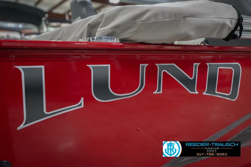 Slide: The Image of 2023 Lund 1650 Angler SS boat, red exterior, displayed at Reeder-Trausch Marine. - 54