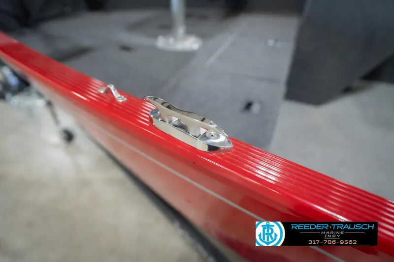 Slide: The Image of 2023 Lund 1650 Angler SS boat with red detailing and cleat, showcased by Reeder Trausch Marine. - 57
