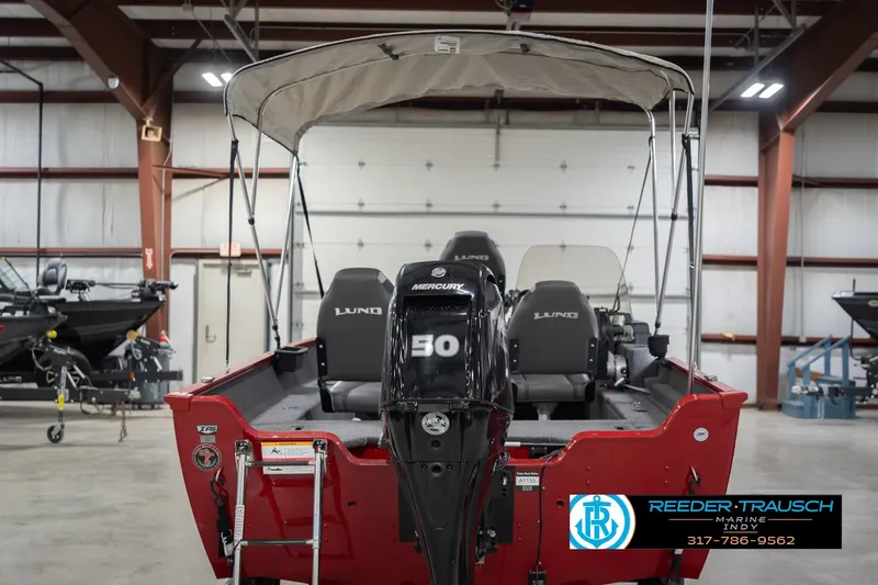 Slide: The Image of 2023 Lund 1650 Angler SS boat with Mercury 50 engine in indoor showroom. - 9