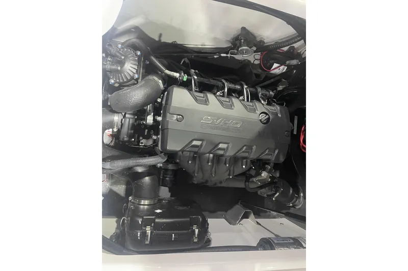 Slide: The Image of 2025 Yamaha Boats 195 FSH Sport engine compartment showcasing advanced marine technology. - 10