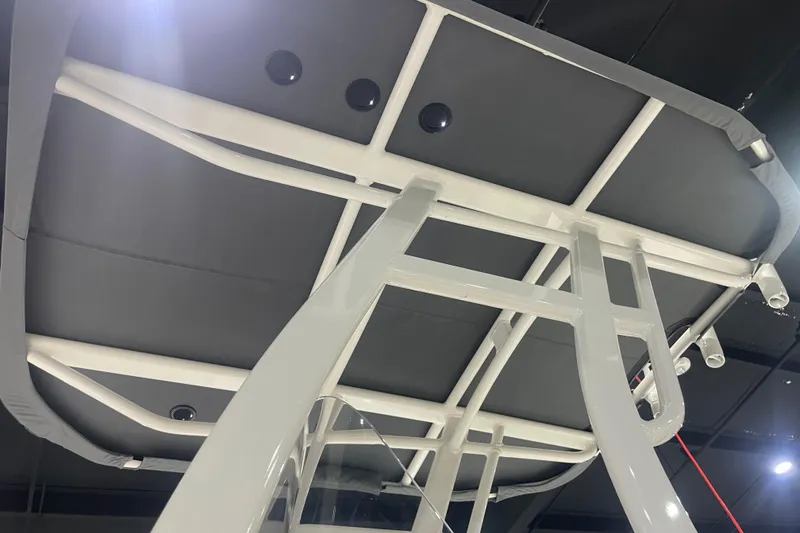 Slide: The Image of 2025 Yamaha Boats 195 FSH Sport T-top structure, showcasing sleek design and sturdy construction. - 9